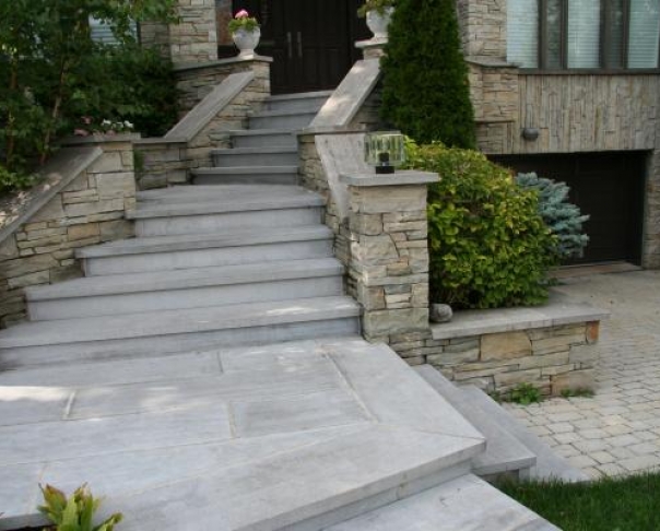 St Marc step capping and techo bloc interlock drivewayAC - St-Marc cut stone on waterproofing membrane